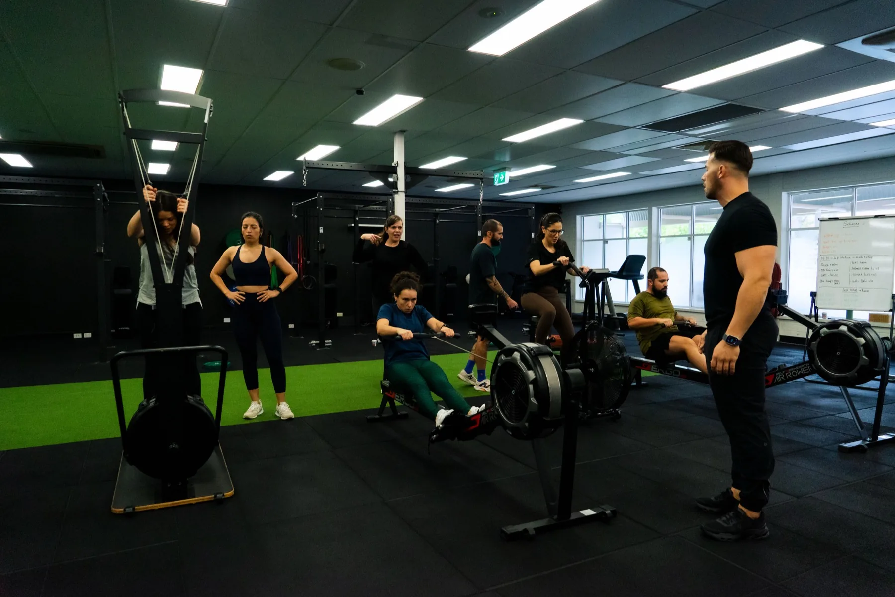 Group class using rowing and ski erg stations together