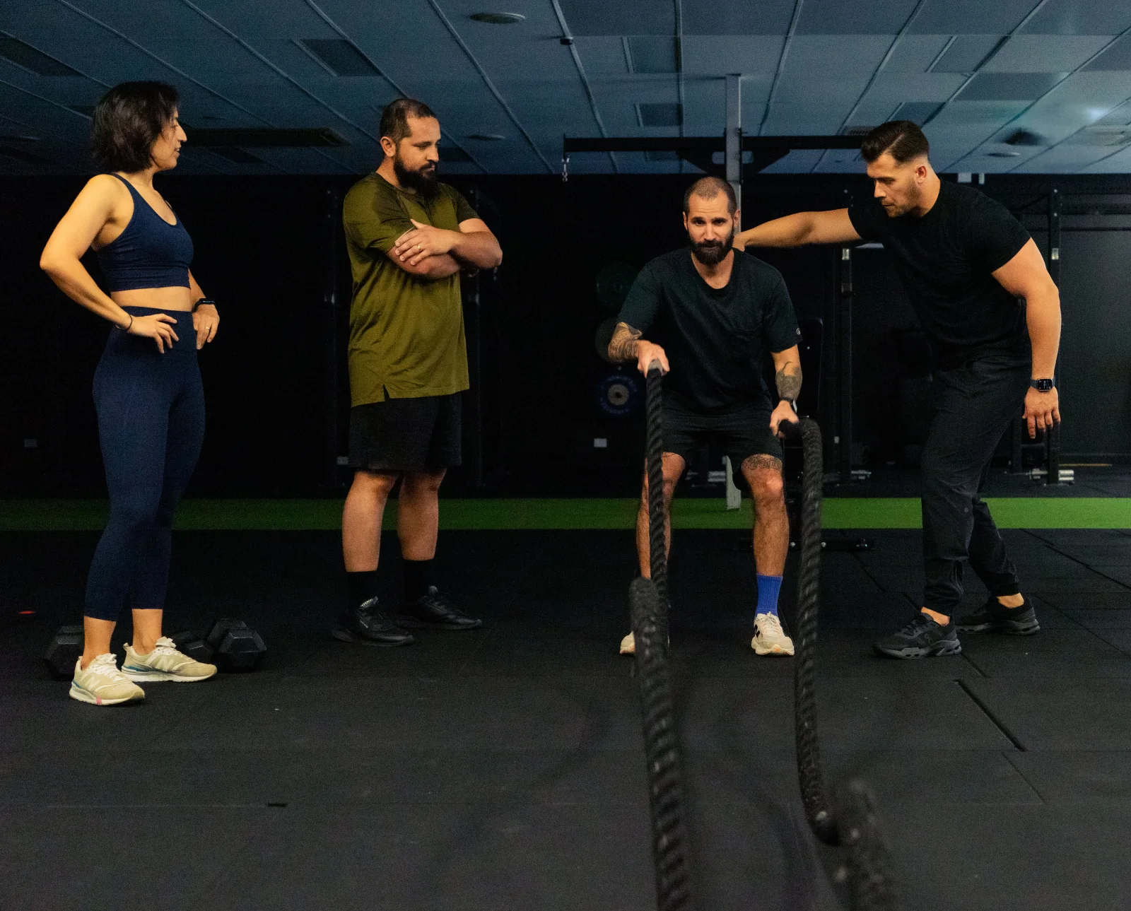 Hudson coaching battle rope work with clients