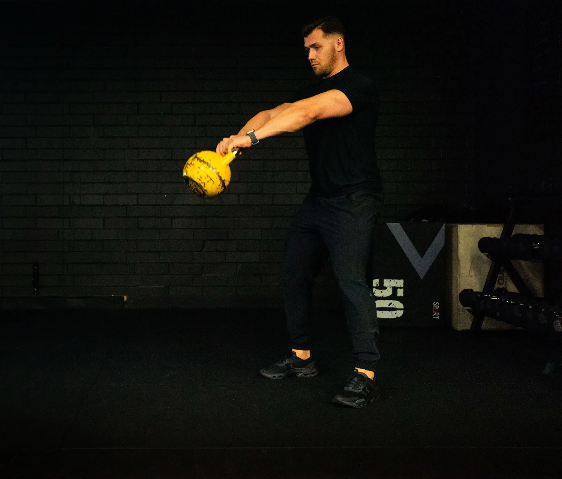 Hudson demonstrating a kettlebell swing