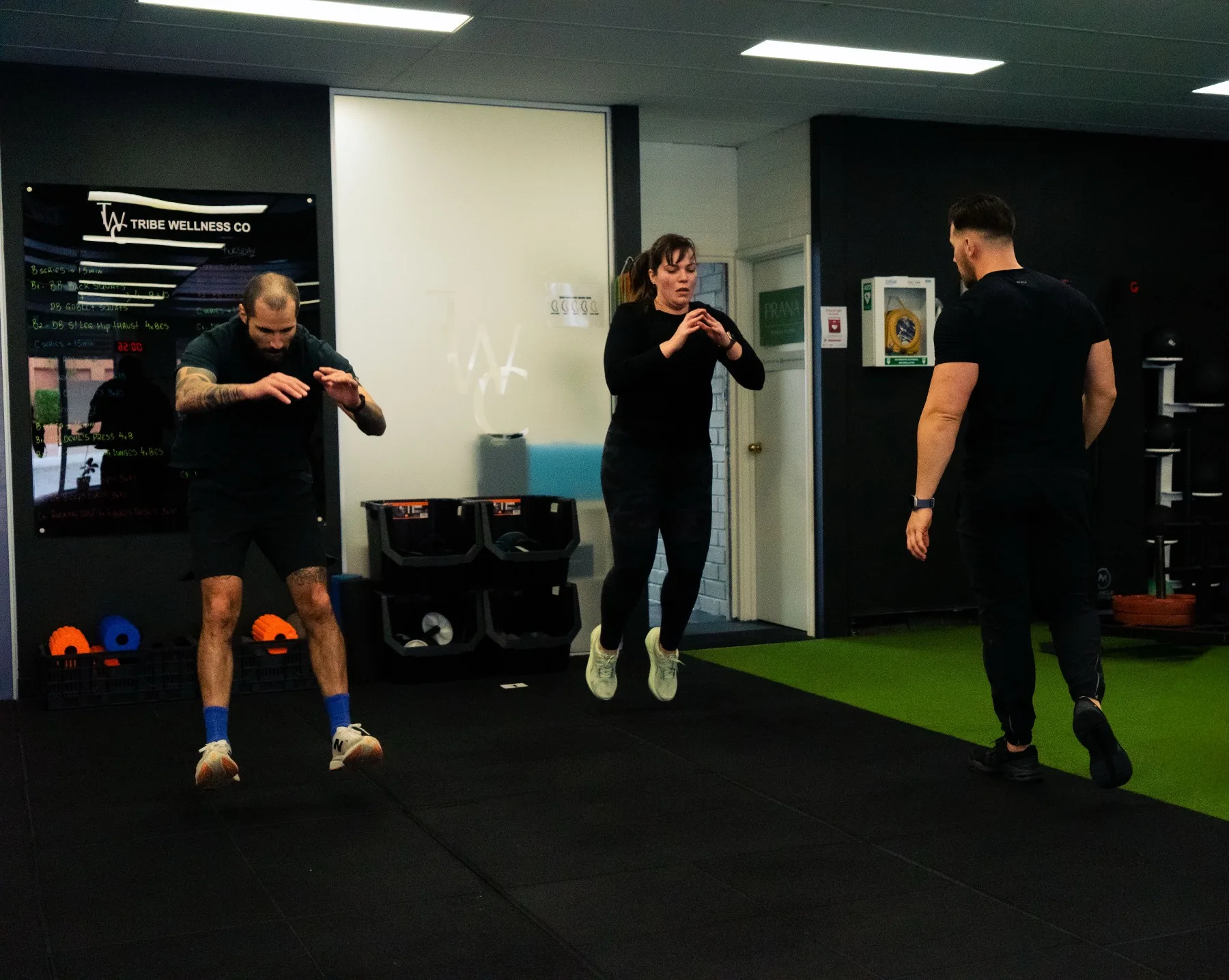 Hudson coaching clients during jump squat conditioning