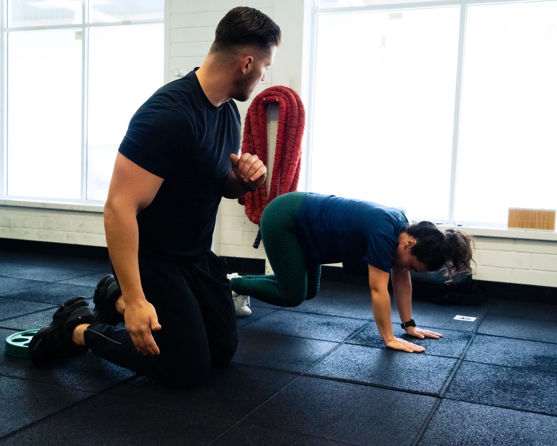 Hudson coaching a client through floor conditioning