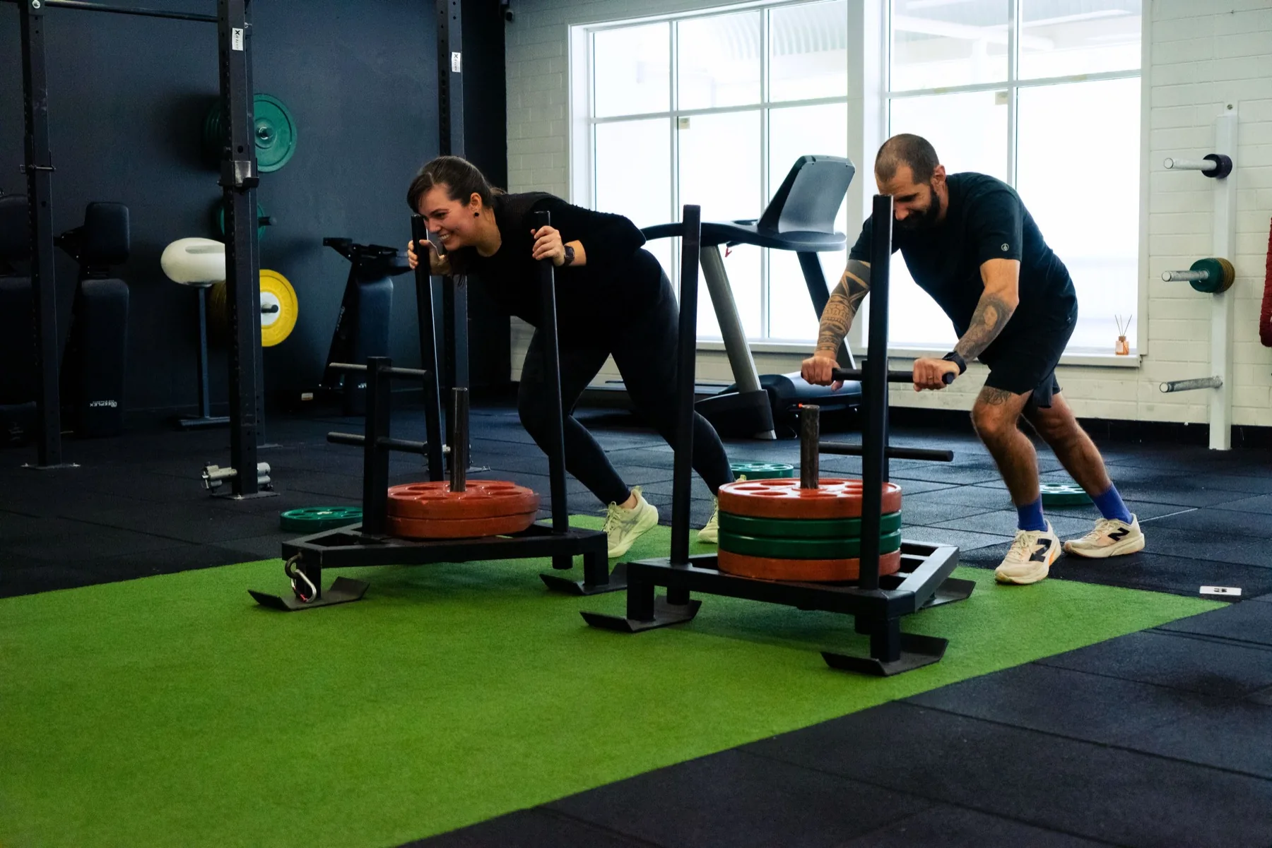 Clients driving sleds forward with low body position