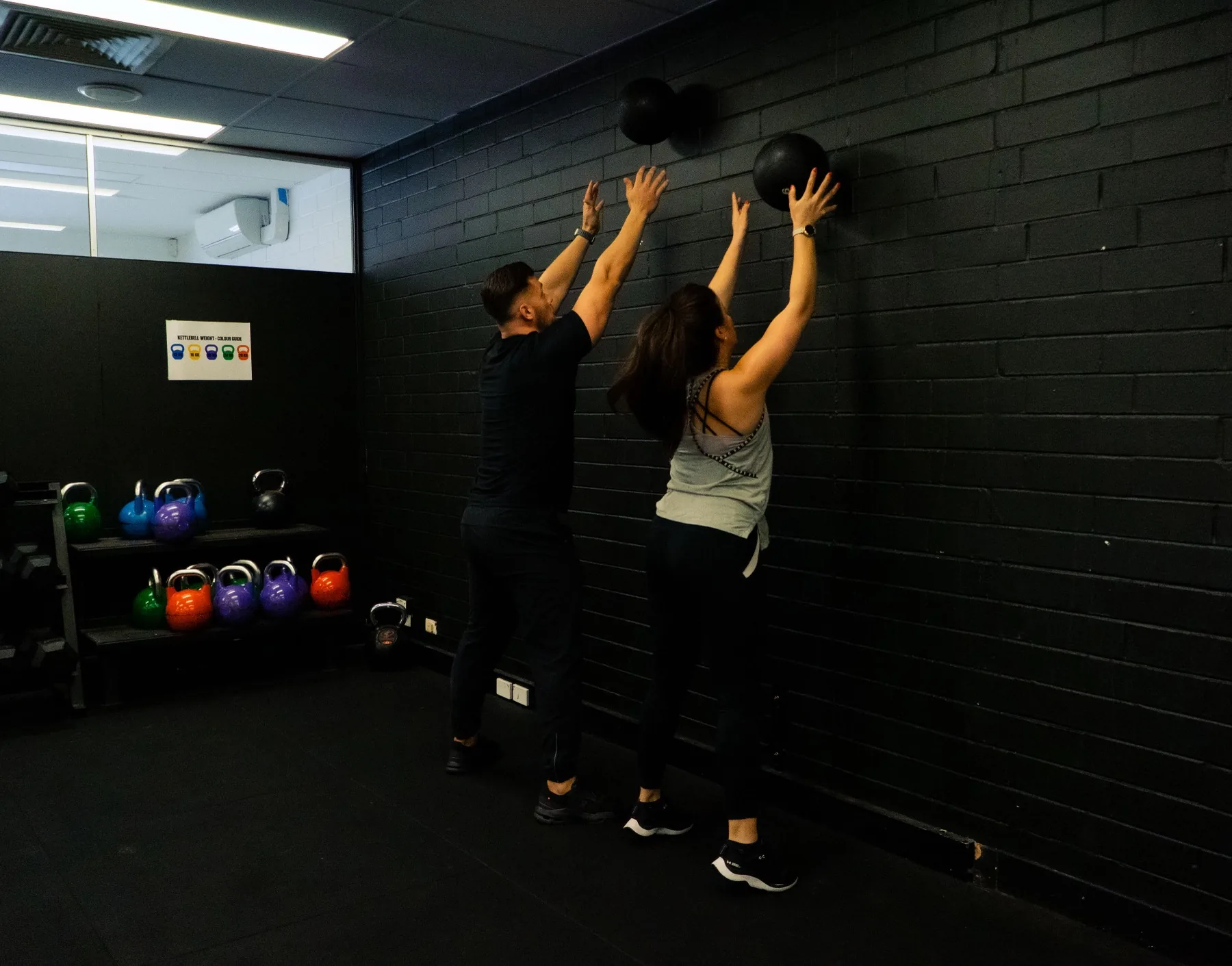 Hudson and a client preparing wall ball throws