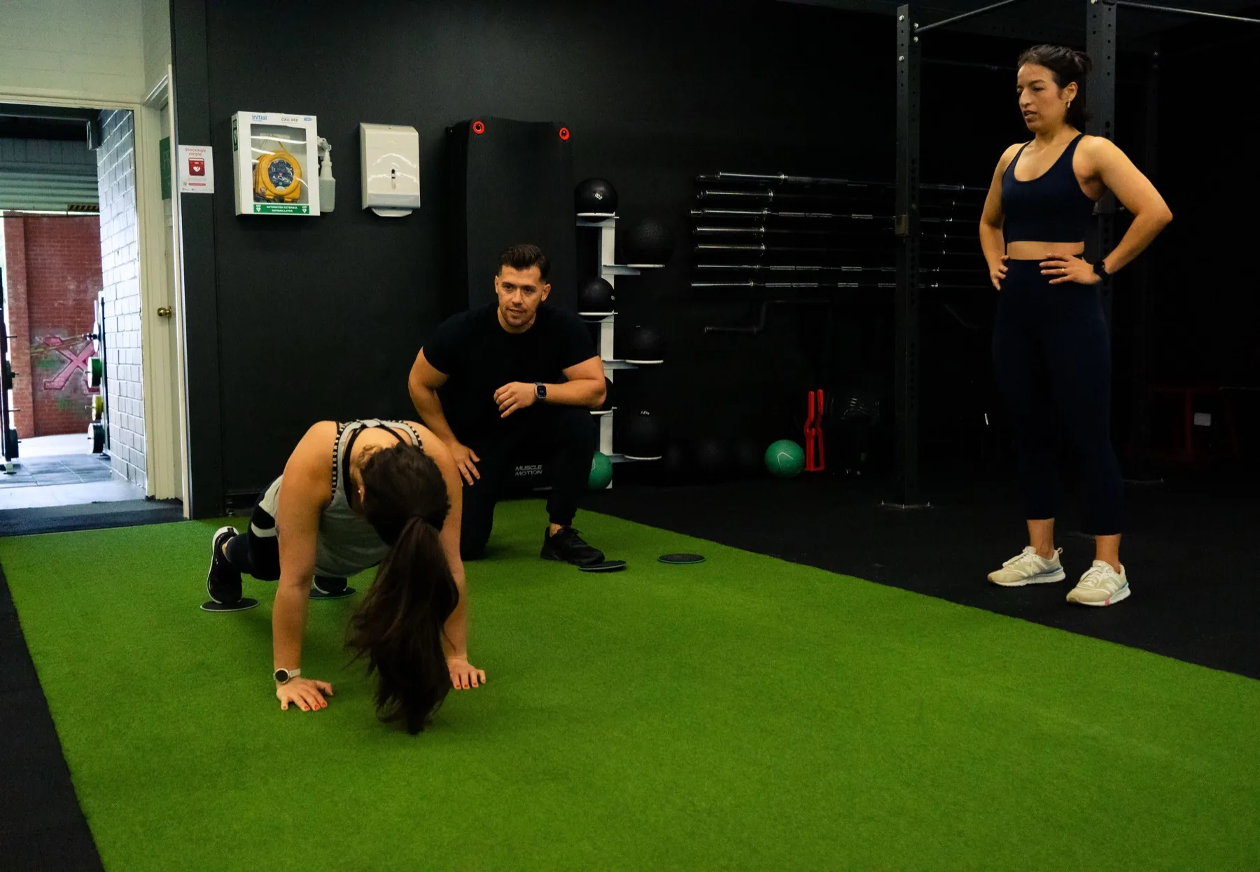 Hudson and clients running a bear crawl conditioning station