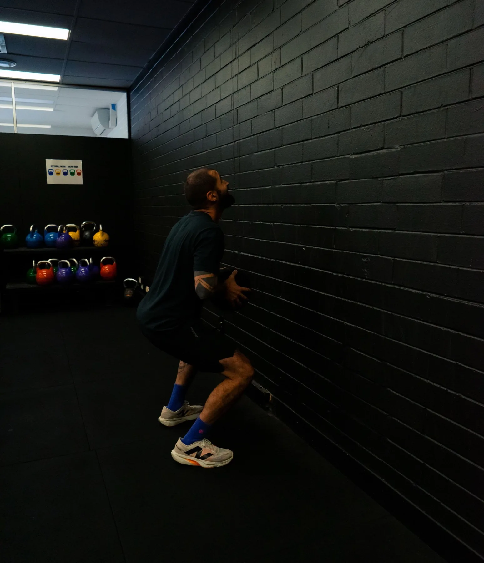 Client catching a wall ball during indoor conditioning